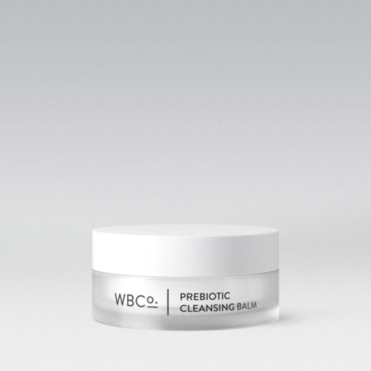 Refined x WBco Prebiotic Cleansing Balm 85g glass jar beside folded organic cotton and bamboo cloth